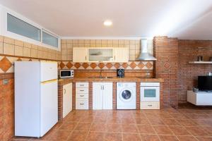 Kuchyň nebo kuchyňský kout v ubytování Apartamento Alberti + 26 fotografií