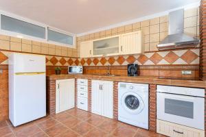 Kuchyň nebo kuchyňský kout v ubytování Apartamento Alberti