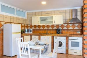 Kuchyň nebo kuchyňský kout v ubytování Apartamento Alberti