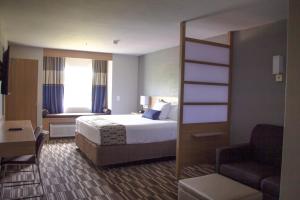 Postel nebo postele na pokoji v ubytování Microtel Inn & Suites by Wyndham Camp Lejeune/Jacksonville