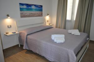Posteľ alebo postele v izbe v ubytovaní Casa Vacanze Monte Cofano