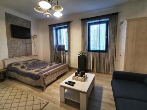 Posteľ alebo postele v izbe v ubytovaní Á-B Apartman