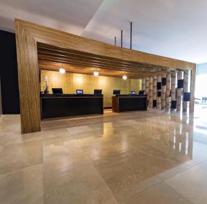 an office with a large lobby with desks and chairs at Fiesta Americana Ciudad de Mexico Toreo in Mexico City