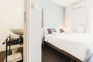 Ein Bett oder Betten in einem Zimmer der Unterkunft Athens Studios