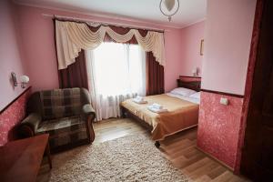 Ένα ή περισσότερα κρεβάτια σε δωμάτιο στο U Tetyany +60 φωτογραφίες