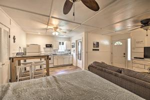 a living room with a bed and a couch and a kitchen at Pet-Friendly Canyon Lake Studio Fish, Boat, Relax in Canyon Lake
