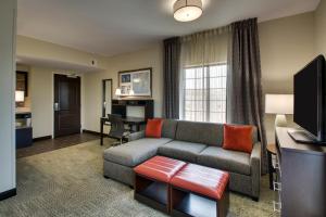a living room with a couch and a table at Staybridge Suites - Rock Hill, an IHG Hotel in Rock Hill