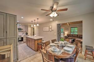 a dining room and kitchen with a table and a ceiling fan at Large Mtn Cabin Golf, Lake, Resort Amenity Access in Newland