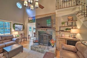 a living room with a fireplace and a couch at Large Mtn Cabin Golf, Lake, Resort Amenity Access in Newland