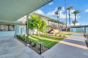 an exterior view of a building with palm trees at Modern Contemporary OT Scottsdale with Heated Pool in Scottsdale