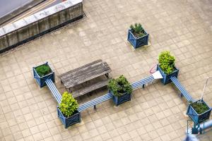 an overhead view of a bench and potted plants at City View Apartments in Birmingham