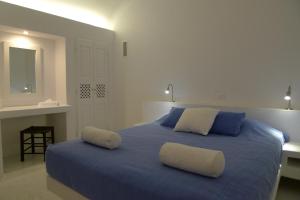 A bed or beds in a room at Altana Heritage Suites