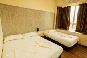 Postelja oz. postelje v sobi nastanitve Expo Hotel