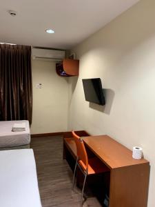 TV a/nebo společenská místnost v ubytování New Grand Hotel