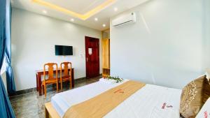 Postel nebo postele na pokoji v ubytování Gao Hotel