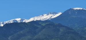 a group of mountains with snow on them at Xenios Dias Boutique Hotel in Litochoro