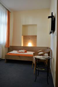 Posteľ alebo postele v izbe v ubytovaní Hotel Praha Potštejn