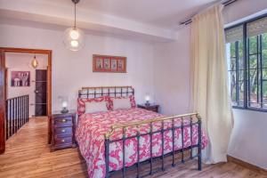 Łóżko lub łóżka w pokoju w obiekcie Casa Rural Monte Dios