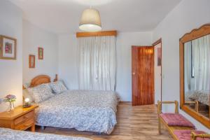 Łóżko lub łóżka w pokoju w obiekcie Casa Rural Monte Dios