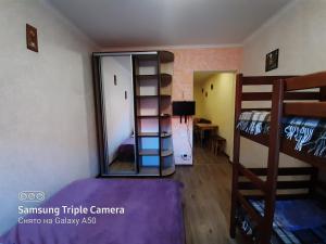 a room with two bunk beds and a mirror at Rand in Fontanka