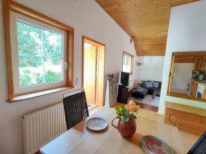 a room with a table with a laptop and a window at Alte Hammerschmiede in Sankt Aegidi