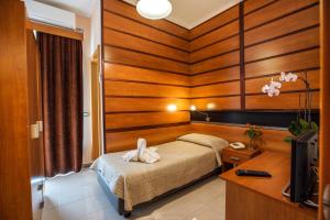 Ένα ή περισσότερα κρεβάτια σε δωμάτιο στο Hotel Murgia
