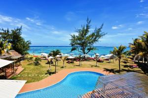 a view of the beach from a resort with a swimming pool at Silver Beach Hotel in Trou dʼ Eau Douce