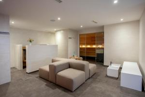 a living room with a couch and a table at Haus Hubertus in Winterspelt