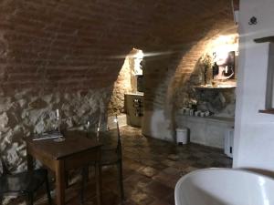 a bathroom with a table and a sink in a room at Apartmany Antico in Mikulov