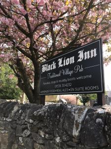 a sign for black zim cultural village pub at Black Lion Inn in Leek +28 photos