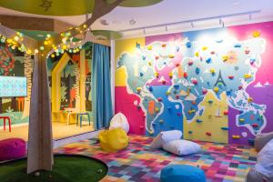 a childrens play room with a puzzle wall at Kempinski Hotel Bahía Beach Resort & Spa in Estepona