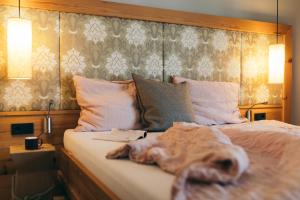 Ένα ή περισσότερα κρεβάτια σε δωμάτιο στο Boutique Hotel Das Rivus