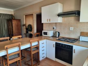 Kuchyň nebo kuchyňský kout v ubytování Alpine Inn
