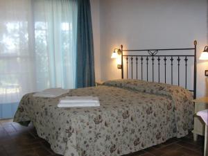 Postel nebo postele na pokoji v ubytování Il Gelsomino Bio Agriturismo