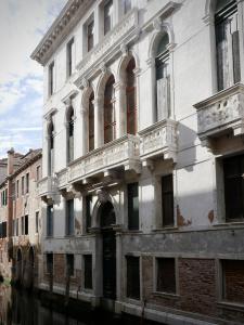 an old white building on a canal at Foresteria Valdese Venezia in Venice