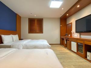 Postel nebo postele na pokoji v ubytování Benikea Daelim Hotel + 37 fotografií