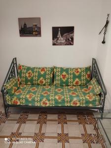 a green couch sitting in a living room at Terra del Sole Ribera in Ribera