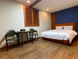 Postelja oz. postelje v sobi nastanitve Benikea Daelim Hotel