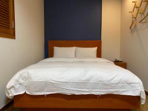 Postelja oz. postelje v sobi nastanitve Benikea Daelim Hotel