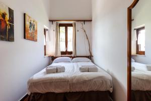 Krevet ili kreveti u jedinici u okviru objekta Solemar Sicilia - Villa Del Faro