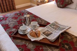 Letto o letti in una camera di Hamlet Court Hotel