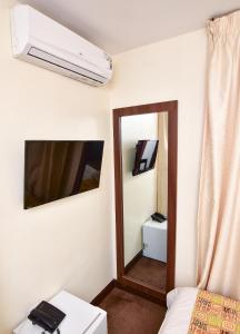 Voodi või voodid majutusasutuse Sinclair Guest House toas