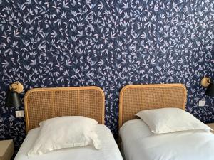 Letto o letti in una camera di Hôtel Central