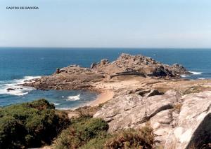 a view of a rocky island in the ocean at Casa Concha in Porto do Son