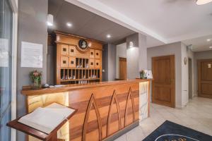 
a kitchen with a wooden counter top and wooden cabinets at Mathias Rex in Szentendre
