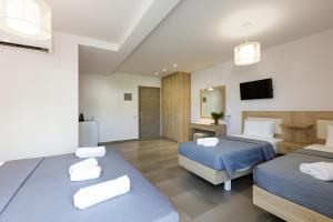 Postel nebo postele na pokoji v ubytování Gorgona Hotel