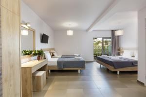 Postel nebo postele na pokoji v ubytování Gorgona Hotel