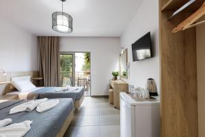 Postel nebo postele na pokoji v ubytování Gorgona Hotel