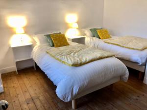 Katil atau katil-katil dalam bilik di Villa vue mer avec acces direct a la plage