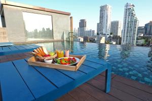 a tray of food on a table on top of a building at The Residence on Thonglor by UHG in Bangkok
